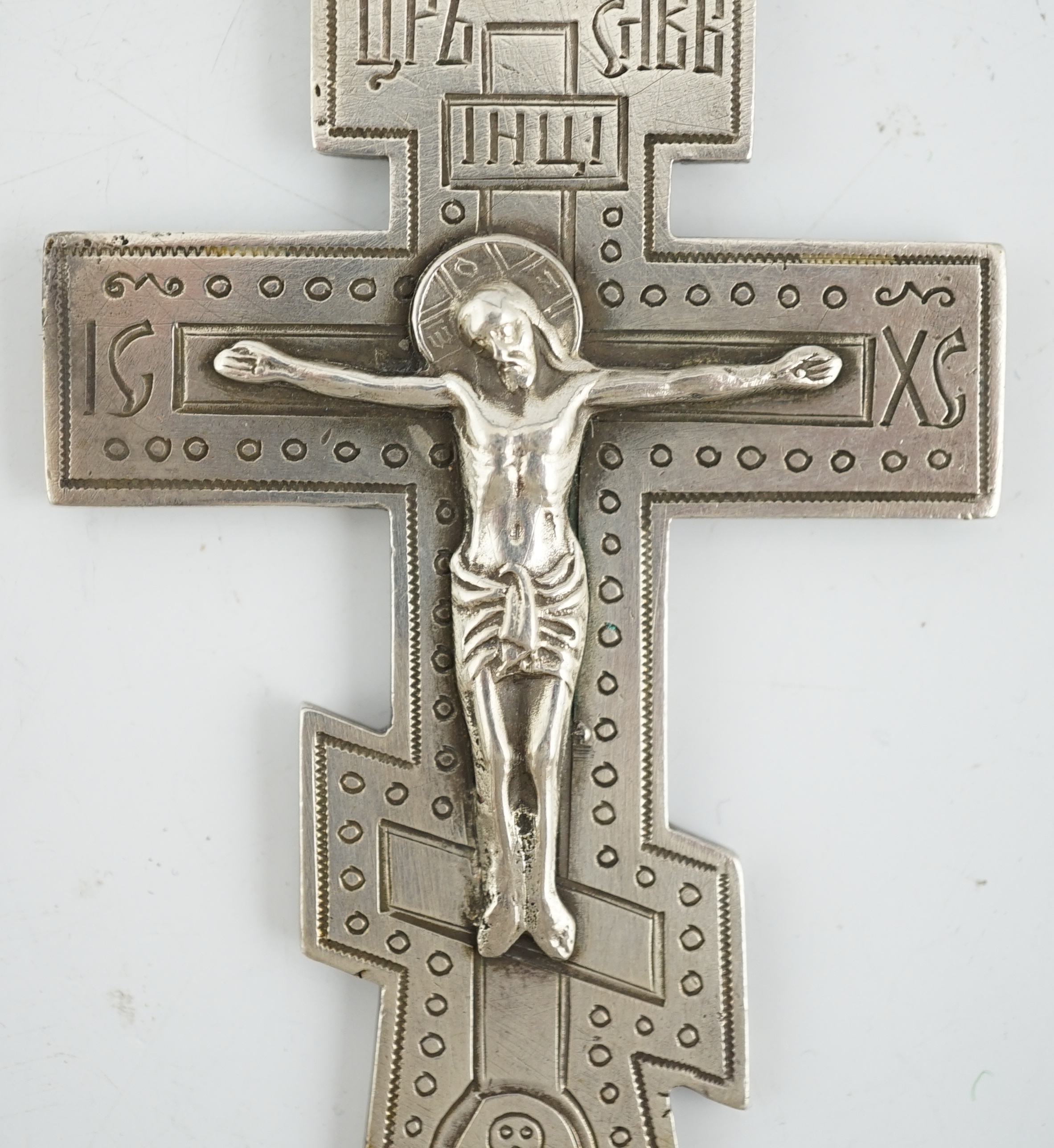 A late 19th century Russian 84 zolotnik silver crucifix, assay master Lev Oleks, Moscow, 1896, engraved with Cyrillic script